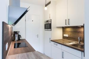 Kuchyň nebo kuchyňský kout v ubytování Hotel Nuhnetal
