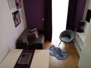 a living room with a table and a couch at Tomena apartments in Trogir