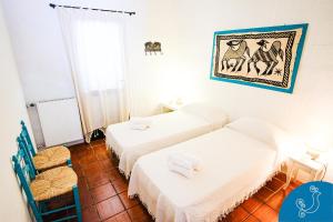 Een bed of bedden in een kamer bij Dimora Caterina - Exclusive villa with sea view