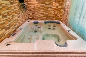 a bath tub with a dog inside of it at Platinum Seventy in Jeddah