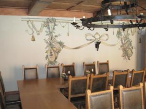 a dining room with a table and chairs at Schloss Schänke garni in Bautzen