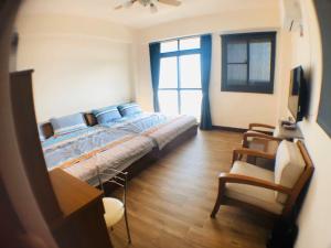 Postel nebo postele na pokoji v ubytování Jieyuan Homestay