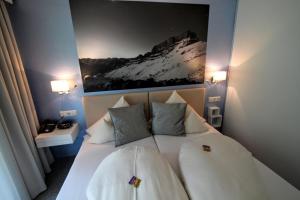 Postel nebo postele na pokoji v ubytování Hotel-Garni Fels