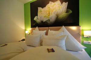 Postel nebo postele na pokoji v ubytování Hotel-Garni Fels