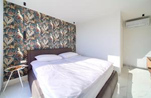 Łóżko lub łóżka w pokoju w obiekcie Casa Forma