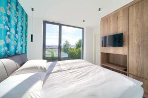 Łóżko lub łóżka w pokoju w obiekcie Casa Forma