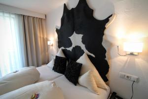 Postel nebo postele na pokoji v ubytování Hotel-Garni Fels