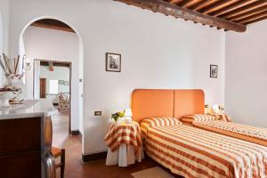 Postel nebo postele na pokoji v ubytování Agriturismo Pometti - Fattoria La Selva + 37 fotografií