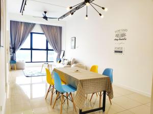 a dining room with a table and chairs at Le Pavilion by Salaam Suites, 5 pax, near Setiawalk in Puchong
