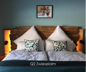 a bedroom with a bed with pillows on it at Dachstein 7 in Gosau