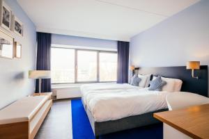 Voodi või voodid majutusasutuse Delta Hotel toas