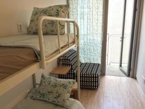 Postel nebo postele na pokoji v ubytování Inside Busan Hostel