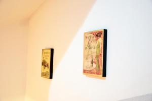 two framed movie posters hanging on a wall at Hotel New Milan in Milan