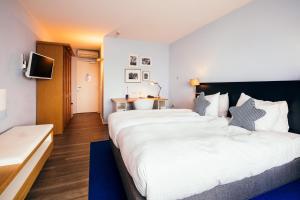 Postel nebo postele na pokoji v ubytování Delta Hotel