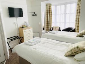 Кровать или кровати в номере Cambrian House