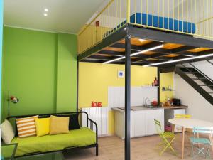 a living room with a loft bed and a kitchen at 2 LOFTS guest house in Turin