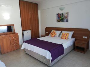 En eller flere senge i et værelse på Balalayka Butik Otel
