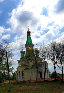 a building with a green steeple on top of it at Agape Glamping in Velika Remeta