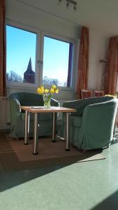 Posezení v ubytování De Kanalkieker Apartmenthaus Meier