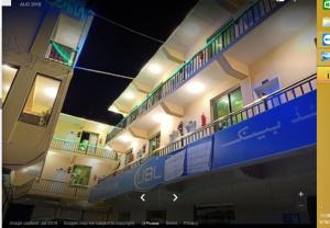a view of a building with people on the balconies at Motel 35 in Alīābād