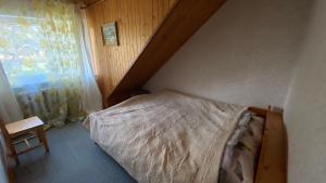 Cama o camas de una habitación en Dana Guest House