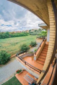 an overhead view of a house with a wooden deck at Affittacamere Le Petit Palais in Castiglione del Lago