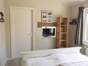 En eller flere senge i et værelse på Westkapellibar