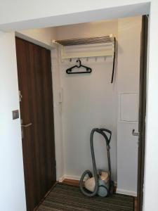 a room with a treadmill next to a door at Apartament Parkowy Rabka in Rabka-Zdrój