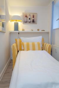 Un pat sau paturi într-o cameră la Watthüs