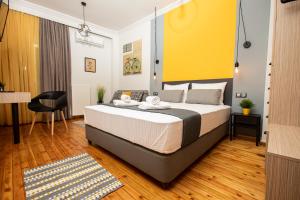 A bed or beds in a room at Thess Quality Urban Living