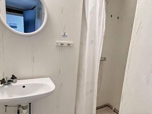 a bathroom with a sink and a mirror at Tranquil Oasis in Northern oland-By Traum in Löttorp +17 photos