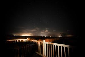 a night sky with a white fence and the stars at Sea 'n' Stars Platinum Plus Holiday home with Views, Free Wifi and Netflix in Camber