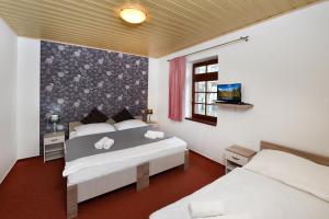 Кровать или кровати в номере Pension Villa Kunerad