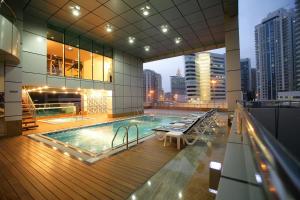 a pool on the roof of a building at Gulf Oasis Hotel Apartments Fz LLC in Dubai