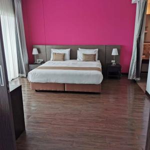 Postel nebo postele na pokoji v ubytování Coco View Hotel