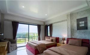 เตียงในห้องที่ Khao Kho Overview Resort