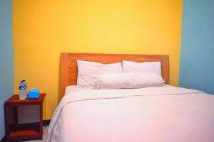 Ein Bett oder Betten in einem Zimmer der Unterkunft RoomZ Budget Residence