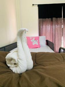 Postel nebo postele na pokoji v ubytování Baan Mae Somkid Homestay