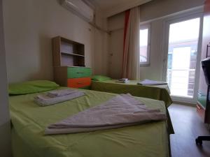 Postel nebo postele na pokoji v ubytování Çanakkale Kampüs Pansiyon
