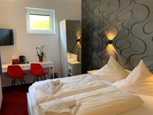 Voodi või voodid majutusasutuse Hotel B54 Heidelberg City Center toas