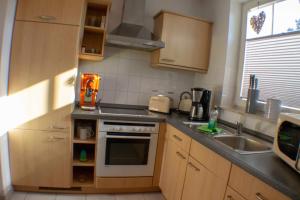Küche/Küchenzeile in der Unterkunft Ferienwohnung Ostseefeeling 3