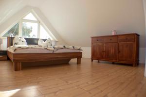 Ein Bett oder Betten in einem Zimmer der Unterkunft Ferienwohnung Ostseefeeling 3