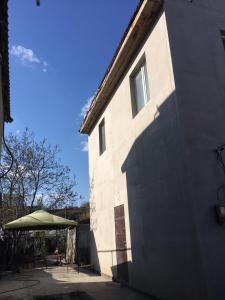 a building with a shadow on the side of it at Villa Bulli in Zatoka