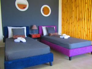 Postel nebo postele na pokoji v ubytování Aristos Apartments & Suites