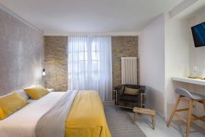 Postel nebo postele na pokoji v ubytování La Casa de Los Arquillos + 32 fotografií