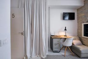 TV a/nebo společenská místnost v ubytování La Casa de Los Arquillos