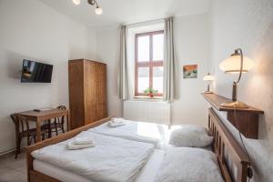 Postel nebo postele na pokoji v ubytování Penzion a restaurace U Hájků