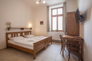 Postel nebo postele na pokoji v ubytování Penzion a restaurace U Hájků