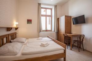 Postel nebo postele na pokoji v ubytování Penzion a restaurace U Hájků