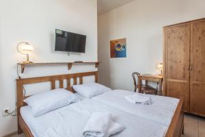 Postel nebo postele na pokoji v ubytování Penzion a restaurace U Hájků